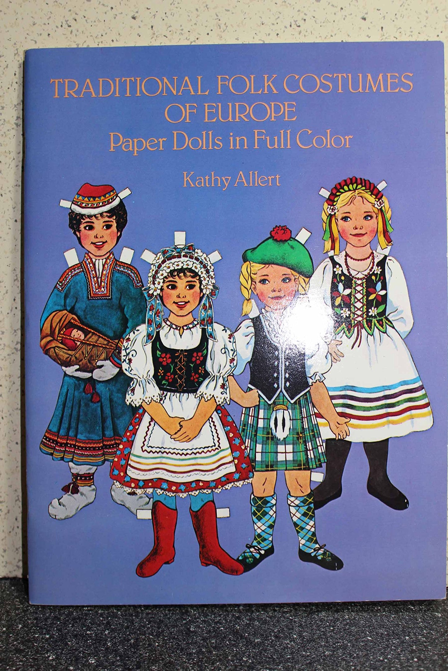 Traditional Folk Costumes of Europe Paper Dolls in Full Color book cover