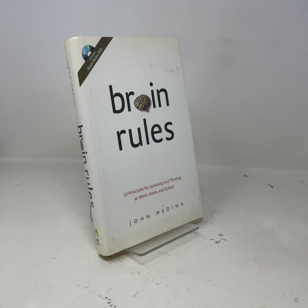 Brain Rules: 12 Principles for Surviving and Thriving at Work, Home, and School [With DVD] book cover